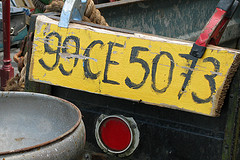 Photo Credit: anadelmann via Compfight cc  A typical sight in Ireland - a number plate (license plate) from the county of Clare (as evidenced by the CE in the middle) attached to the back of a tractor with a pair of clamps. This, of course, is wildly illegal. That doesn't mean you won't see it everywhere you go in the country. 